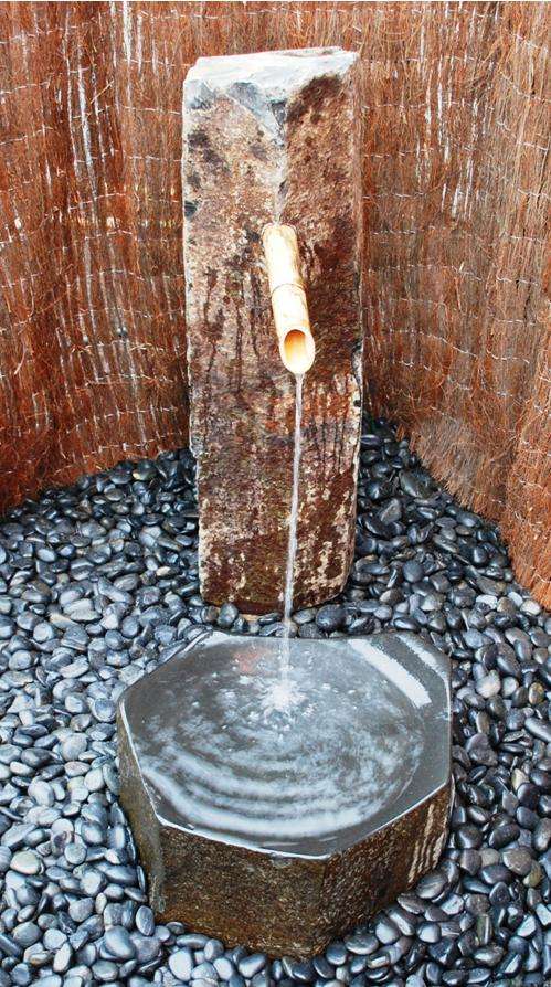 Custom Basalt Fountain - Basalt Bamboo Fountain into Polished Dish Rock