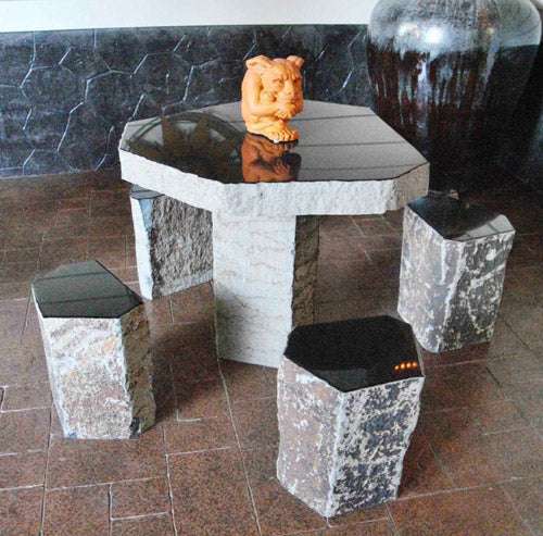 stone basalt table with polished top and chairs